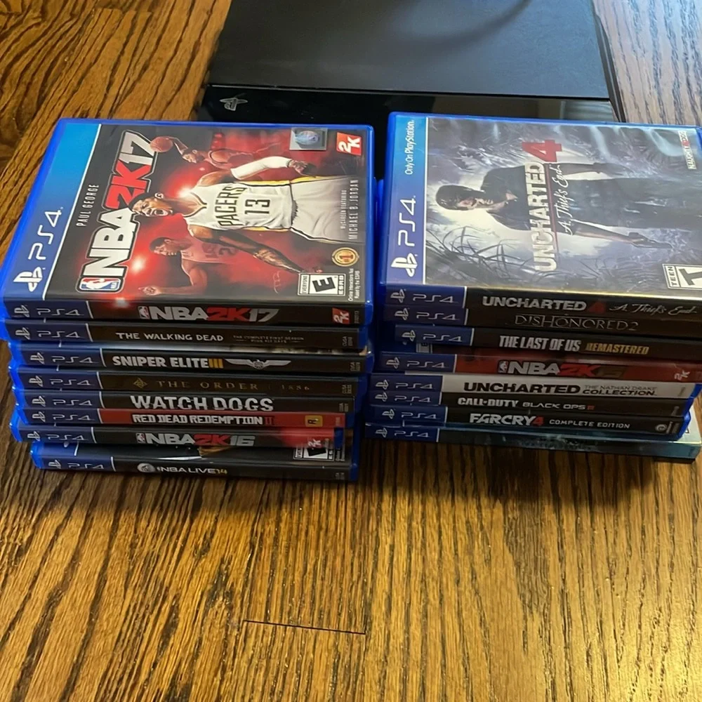 PS4 Console with dual controllers, controller charging station with 16 PS4 games